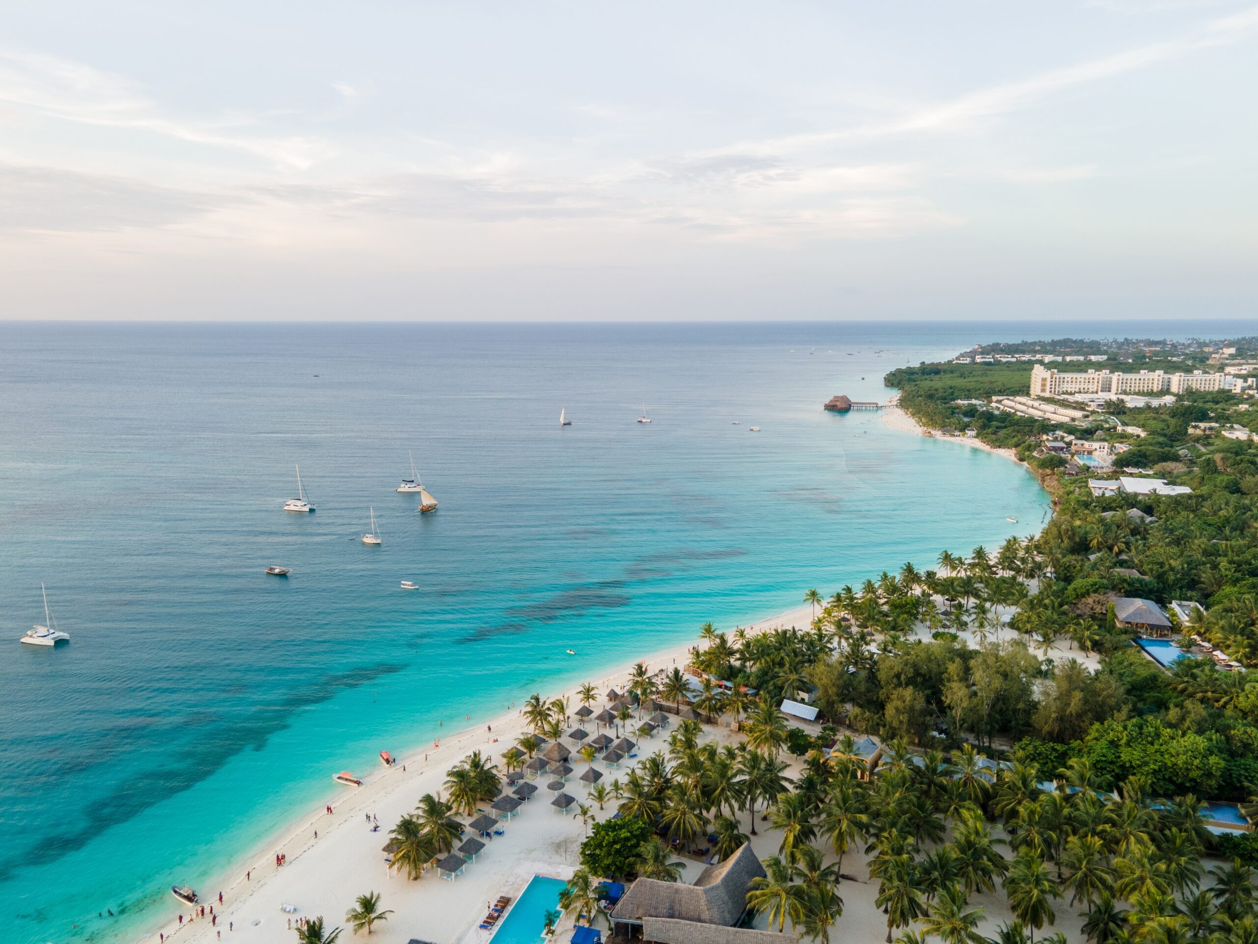 Aerial,View,Of,Sailboats,Anchoring,Near,A,Tropical,Beach,With