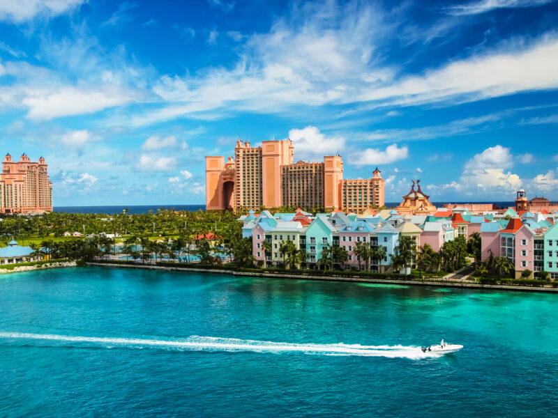 Beautiful,Scene,Of,Speed,Boat,,Ocean,,Colorful,Houses,And,A